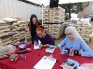 Nancy and Victoria signing books for Emily Neri.